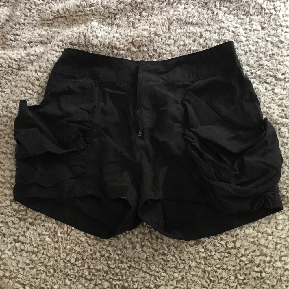 Black shorts with ruffled pockets